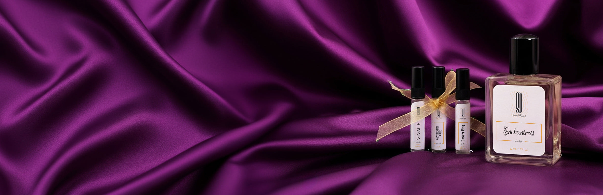 Perfume bottles on a purple satin background